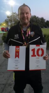 man holding weight loss certificates